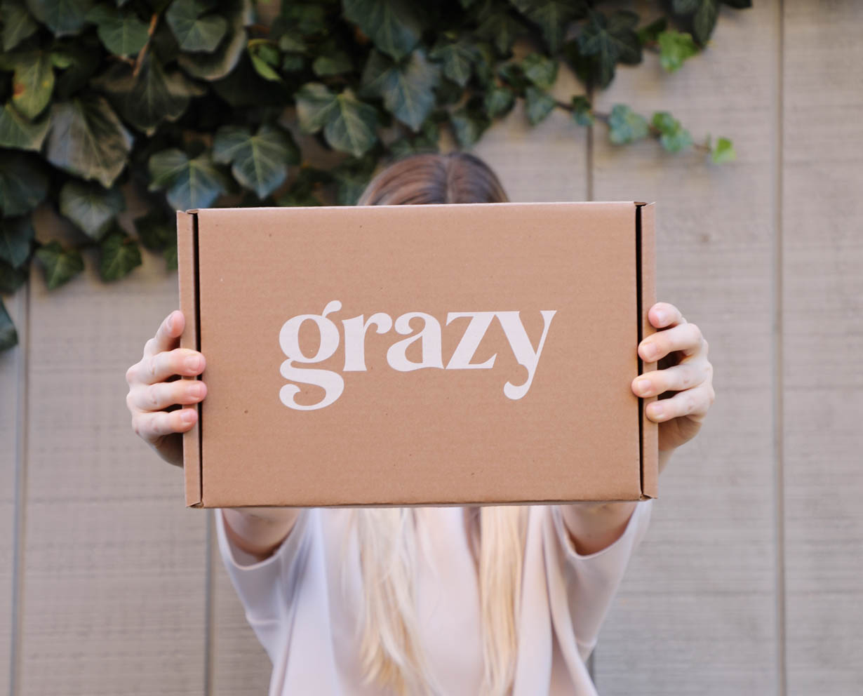 Woman holding a Grazy box.
