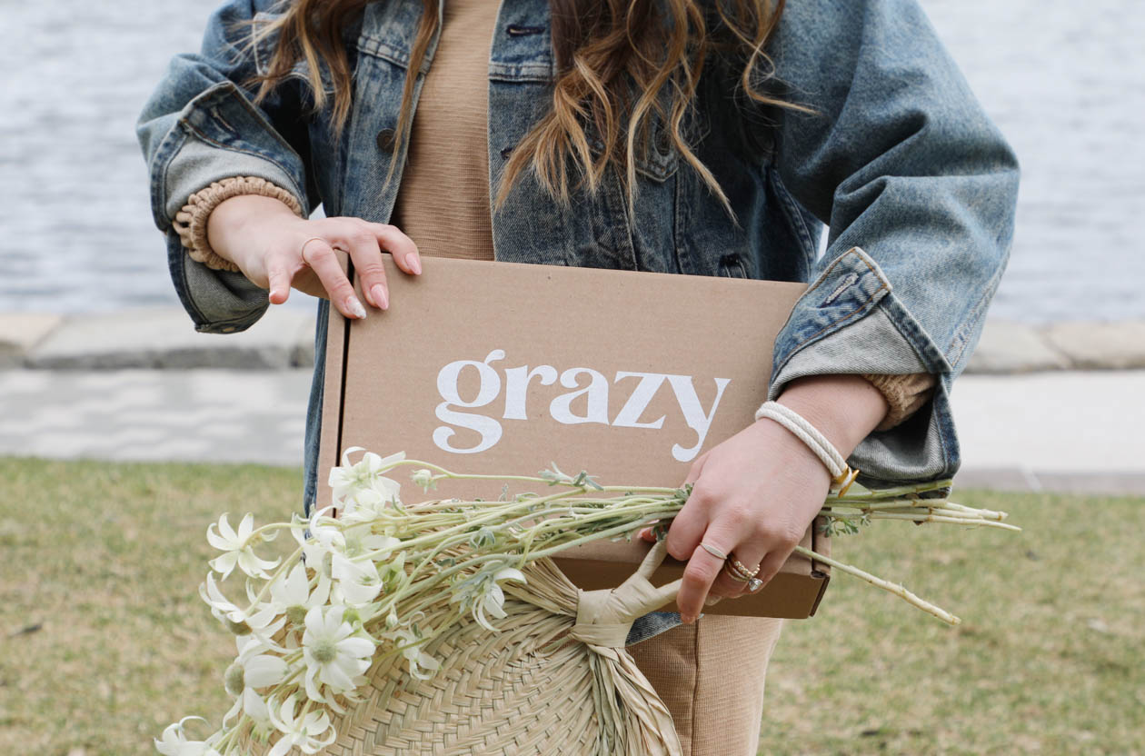 Woman holding a grazy box.